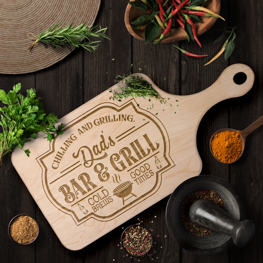 Dads_Bar__Grill_Paddle_Cutting_Board_Light_Handle_Horizontal_Lifestyle_Mockup.png