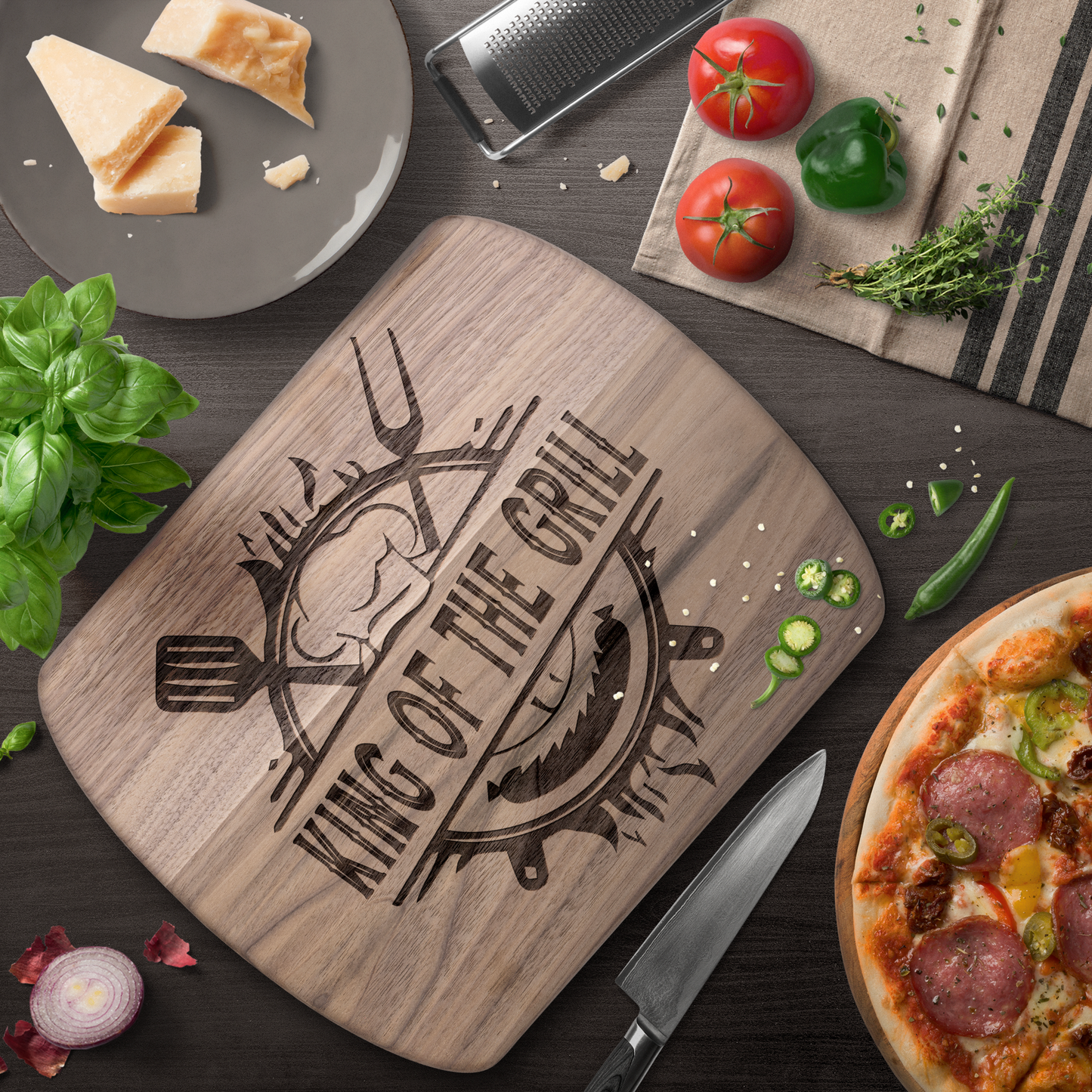 King_of_the_Grill_Oval_Cutting_Board_Dark_Rounded_H_Lifestyle_Mockup.png